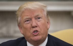 US President Donald Trump speaks during a meeting with former US Secretary of State Henry Kissinger in the Oval Office of the White House in Washington, DC, May 10, 2017.