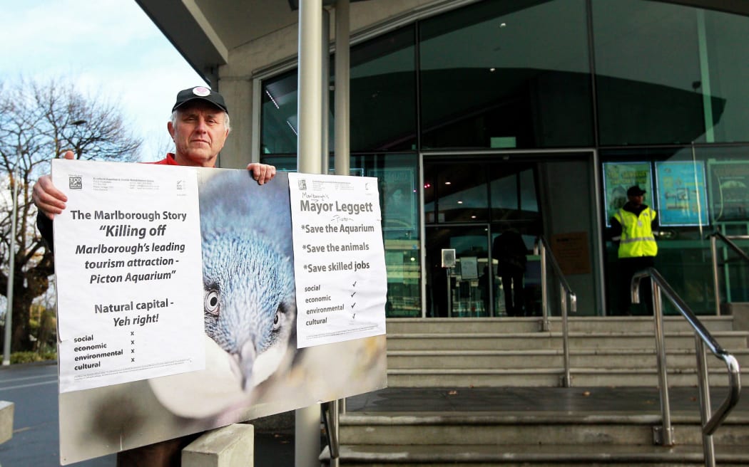 EcoWorld owner John Reuhman protests outside the ASB Theatre during the Local Government Conference on 15 July, 2021.