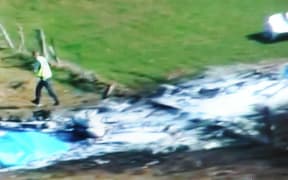 This television frame grab taken from TVNZ television on September 4, 2010 shows the wreckage of a Fletcher FU24 turbine powered skydiving aircraft in a field near Fox Glacier.