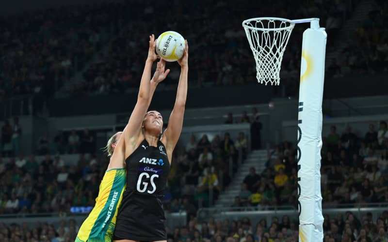 Amelia Walmsley of New Zealand (right) catches the ball during the Constellation Cup match between the Australian Diamonds and the New Zealand Silver Ferns at John Cain Arena in Melbourne.