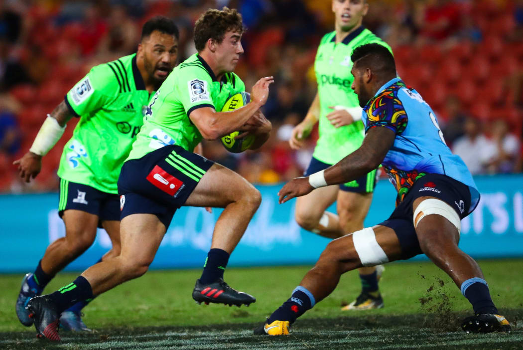 Joshua McKay of the Highlanders runs at Jed Holloway of the Waratahs during the Global Tens Tournament