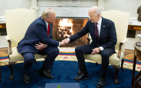 US President Joe Biden shakes hands with US President-elect Donald Trump during a meeting in the Oval Office of the White House in Washington, DC, on November 13, 2024. - Trump thanked Biden for pledging a smooth transfer of power as the victorious Republican made a historic return visit to the White House on Wednesday. (Photo by SAUL LOEB / AFP)