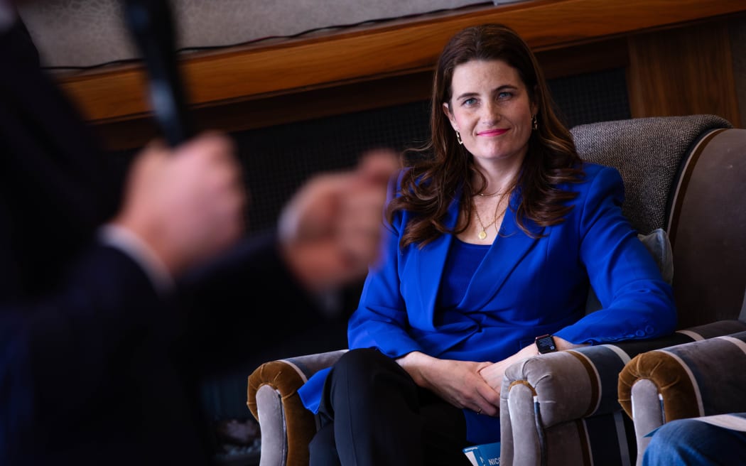 Nicola Willis looks on as National's leader Christopher Luxon speaks at the Malvina Major retirement village in Khandallah, Wellington on the campaign trail on 11 September, 2023.