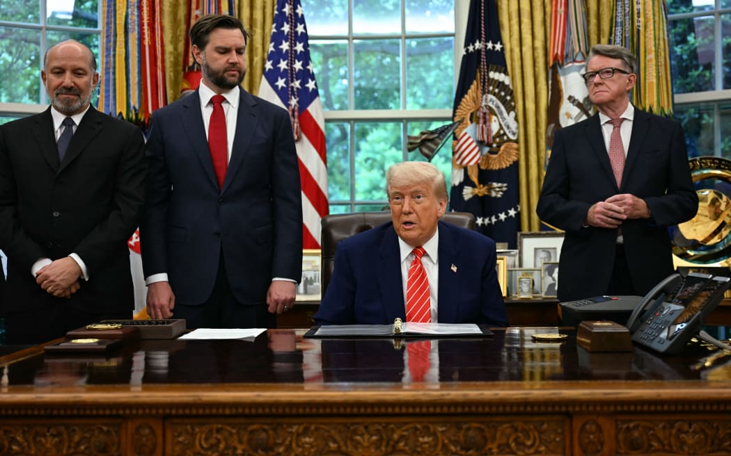 US President Donald Trump makes a trade announcement as US Secretary of Commerce Howard Lutnick (L), US Vice President JD Vance (2L), and British ambassador to the United States Peter Mandelson look on in the Oval Office of the White House in Washington, DC, on 8 May, 2025.