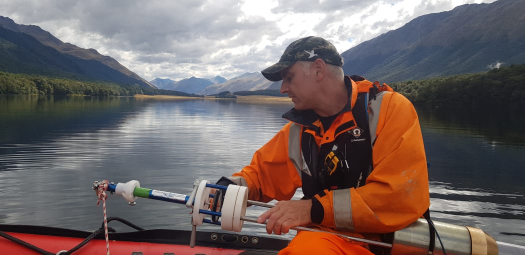 Marcus Vandergoes with the sediment corer, South Mavora Lake, Southland.