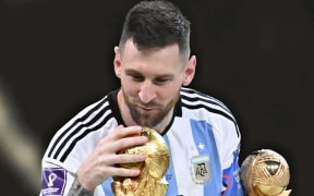 Lionel Messi of Argentina celebrates during an award ceremony of 2022 FIFA World Cup in Qatar.