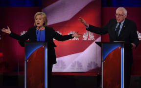 US Democratic presidential candidates Hillary Clinton (L) and Bernie Sanders (R) participate in the latest Democratic Candidates Debate