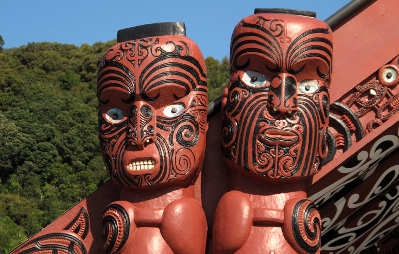 Carved figures on the amo - the posts on either side of the front of the wharenui.