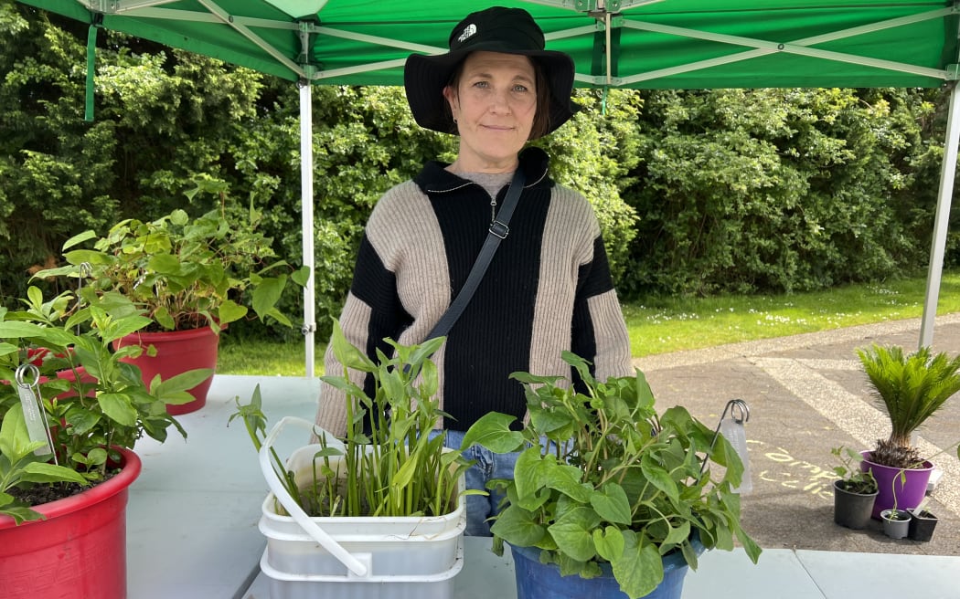 Lydia Starr, Auckland Council senior biosecurity advisor, with pest plants Sagittaria and Houttuynia