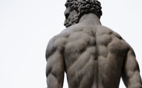 male statue from behind