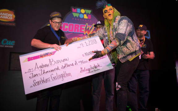 Andrew Barrow receives his oversized cheque.