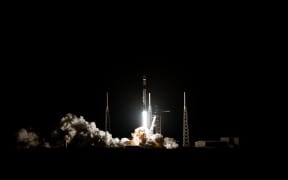 Space X Falcon delivering satellites into space.