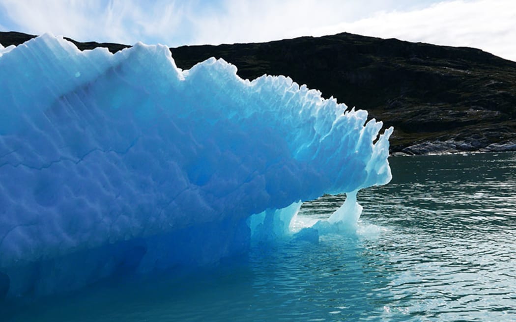 Blue iceberg calved from Eqi Glacier