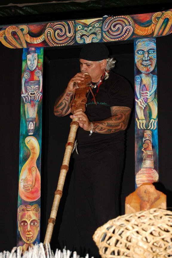 Artist James Webster with an example of what he calls karetao pūoro - singing Māori puppets.