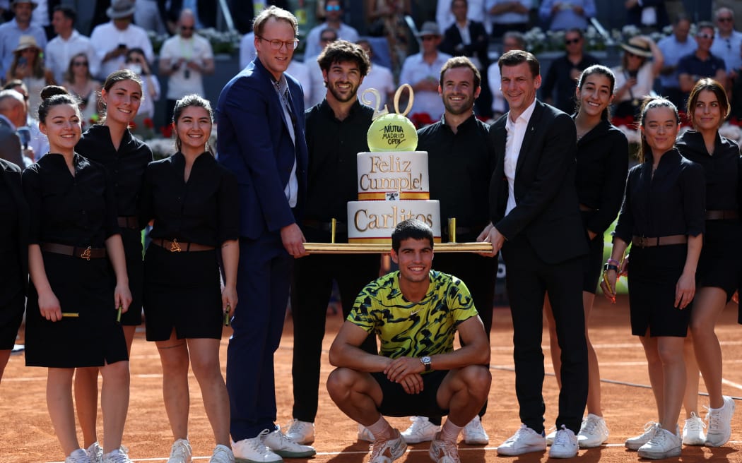 Members of the Madrid Open tournament staff hold a cake for Spain's Carlos Alcaraz, for his 20th birthday, 2023.