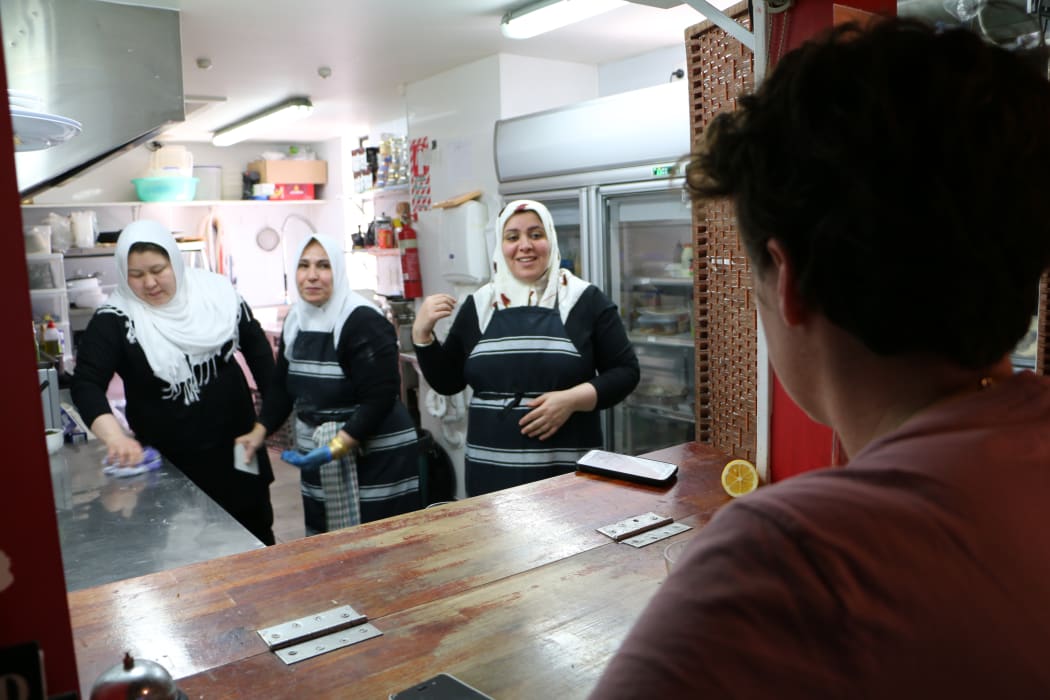 Rebecca checks in on Fatima, Muna and Hajar in the kitchen of Adulis Restaurant