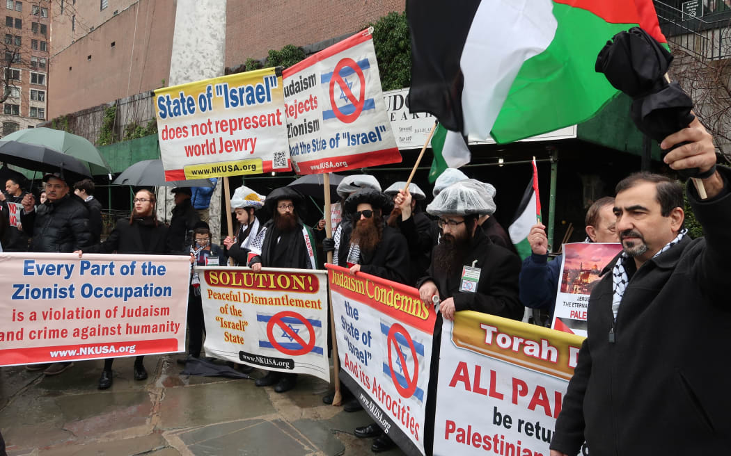 NEW YORK, USA - FEBRUARY 11: A group of protesters gather in front of United Nations headquarters to protest against U.S. President Donald Trump's Middle East plan as Palestinian President, Mahmoud Abbas speaks at the UN Security Council meeting in New York, on February 11, 2020.