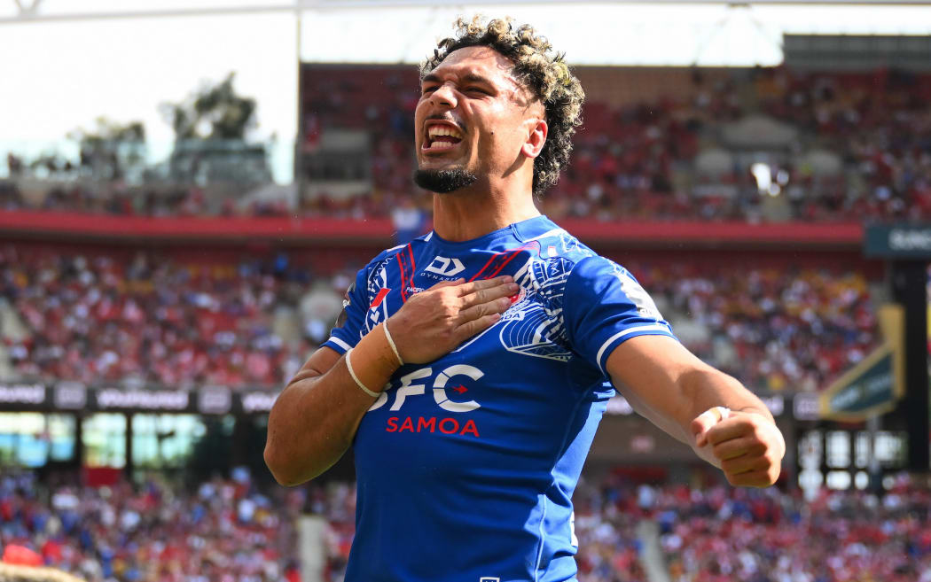 Izack Tago of Samoa celebrates his try, Tonga XIII v To a Samoa, round 2 of the Pacific Championship rugby league match at Suncorp Stadium, Brisbane.