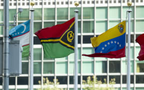 The flag of the Republic of Vanuatu (centre) flying at United Nations headquarters in New York.