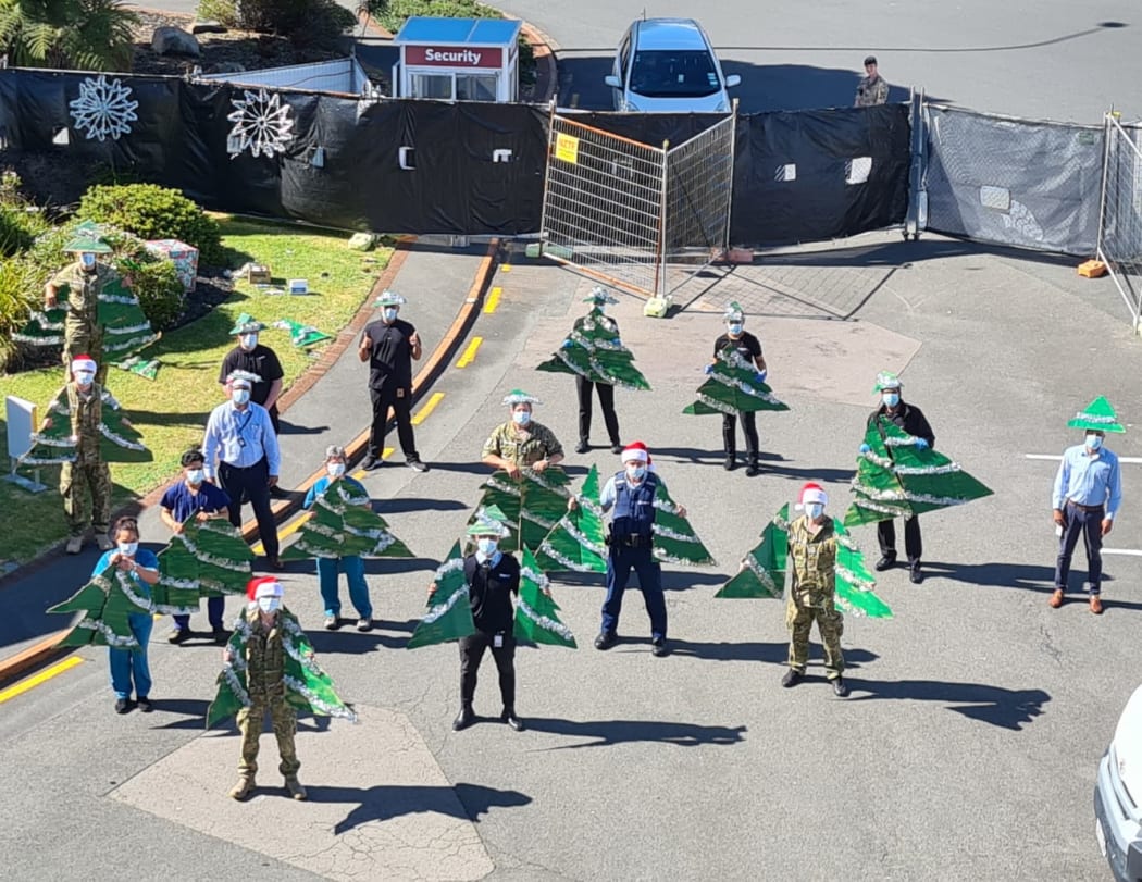 Staff at MIQ in Rotorua's Sudima socially distance with festive cheer on Christmas.