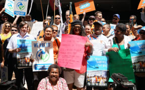 Australian unionists protesting outside Fiji's consulate in Sydney in support of Fijian airport workers.
