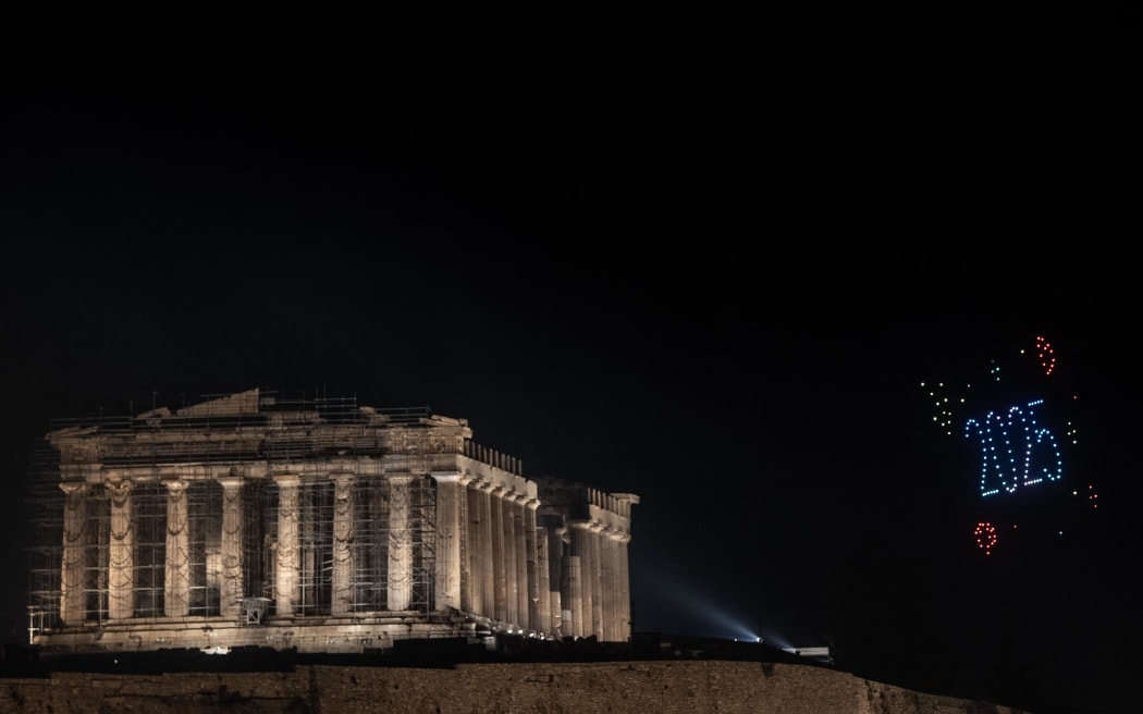 Drones form a ''2025'' next to the ancient Parthenon temple atop the Acropolis during New Year celebrations in Athens, Greece, on January 1, 2025. (Photo by Dimitris Lampropoulos/NurPhoto) (Photo by Dimitris Lampropoulos / NurPhoto / NurPhoto via AFP)