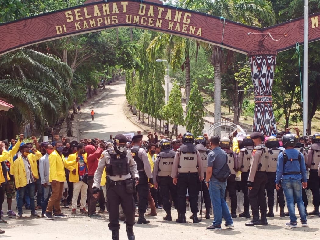 Indonesian police stop a protest by West Papuan students at Cenderawasih University in Jayapura, 28 September 2020.