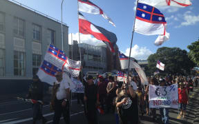A group of protesters - including members of rival faction Te Kotahitanga - take to the streets to oppose Tūhoronuku's appointment to carry out treaty negotiations on behalf of Ngāpuhi.