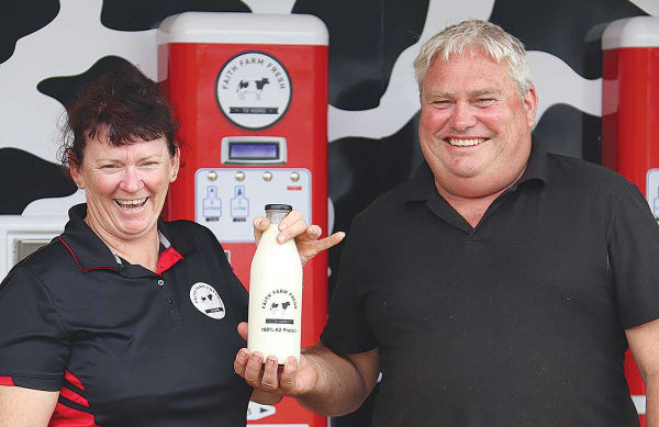 Otaki dairy farmers Stacy and Andrew Faith with their raw milk vending machine