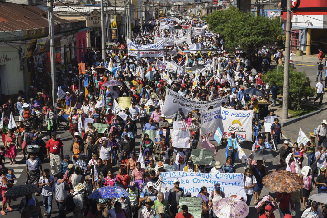 Members of the Peasant Development Committee march to demand the resignation of Guatemalan President Jimmy Morales and the renewal of the mandate of an anti-corruption mission of the UN, in Guatemala City on September 12, 2018.