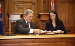 Jacinda Ardern and Winston Peters signing the coalition agreement.