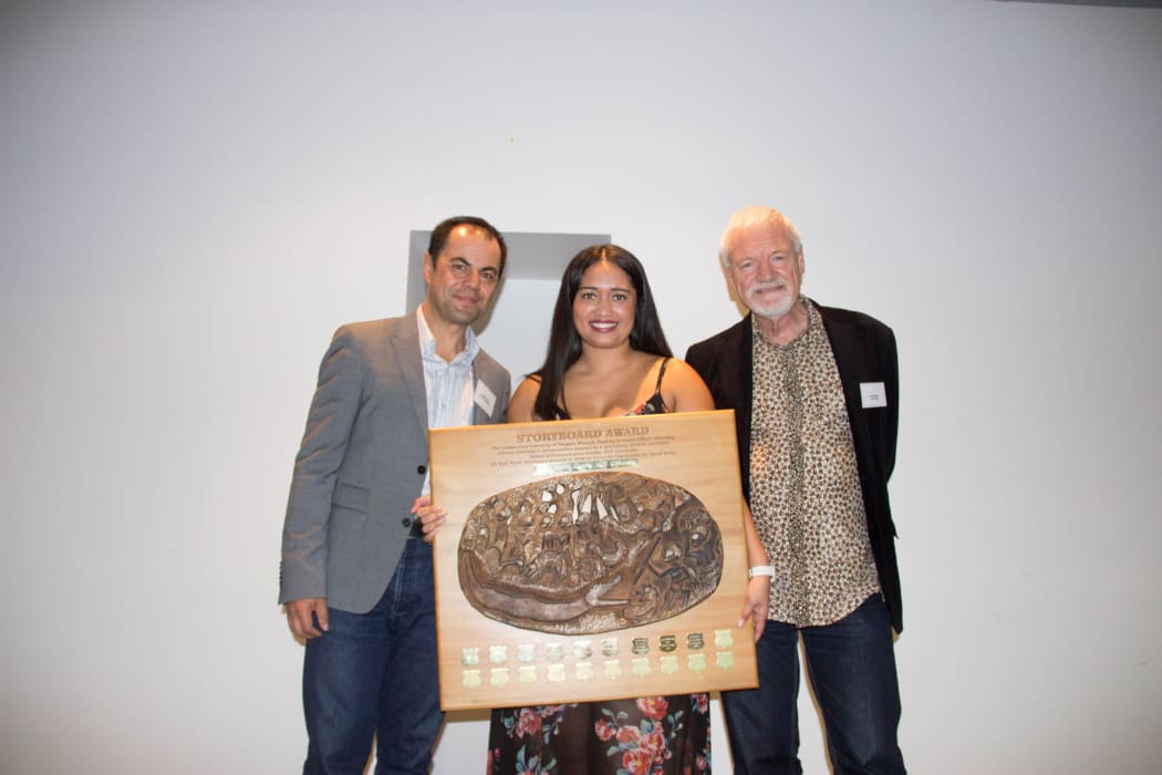 Alistar Kata holding the Spasifik Magazine Prize and Storyboard Award for Diversity Reporting, with Spasifik Magazine publisher Innes Logan and Pacific Media Watch Director, Professor David Robie.