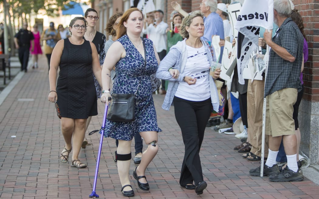 Boston Marathon Bombing victim Erika Brannock, centre, arrives at the sentencing of Boston Marathon Bomber Dzhokhar Tsarnaev.