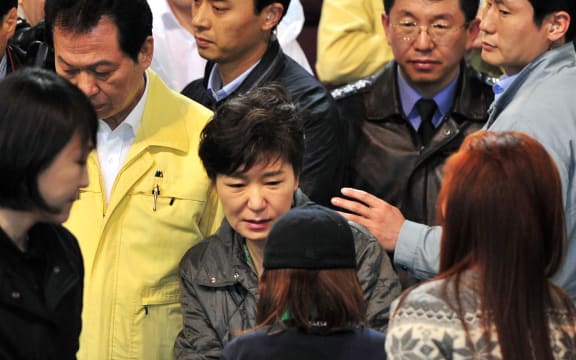 President Park Geun-Hye, centre, meets with relatives of missing passengers.