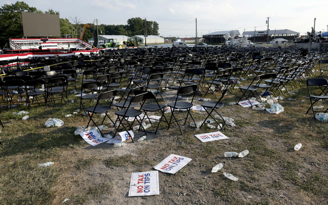 BUTLER, PENNSYLVANIA - JULY 13: Campaign signs and empty water bottles are seen on the ground of a campaign rally for Republican presidential candidate former President Donald Trump on July 13, 2024 in Butler, Pennsylvania. According to Butler County District Attorney Richard Goldinger, the suspected gunman is dead after injuring former President Trump, killing one audience member and injuring at least one other.   Anna Moneymaker/Getty Images/AFP (Photo by Anna Moneymaker / GETTY IMAGES NORTH AMERICA / Getty Images via AFP)