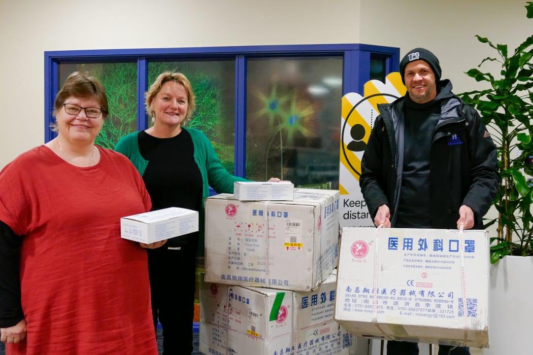 Bronwen Fox of the Disabilities Resource Centre Trust (left) picks up some face masks from Whakatāne District Council chief executive Stephanie O’Sullivan with Te Puna Ora O Mataatua  chief executive Dr Chris Tooley.