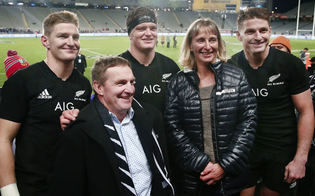 Brothers Jordie, Scott and Beauden Barrett of New Zealand pose for a photo with their parents after the match. All Blacks v Samoa at Eden Park, 2017.