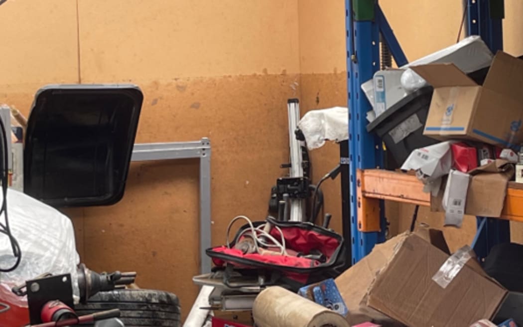 A water line indicating how deep the flood waters swelled to is evident inside the garage of Luisa Hansell's Blockhouse Bay home.