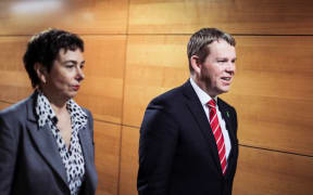 Joint Head of Managed Isolation Megan Main and Covid-19 Response Minister Chris Hipkins head to a briefing on vaccines on Wednesday 14 July.