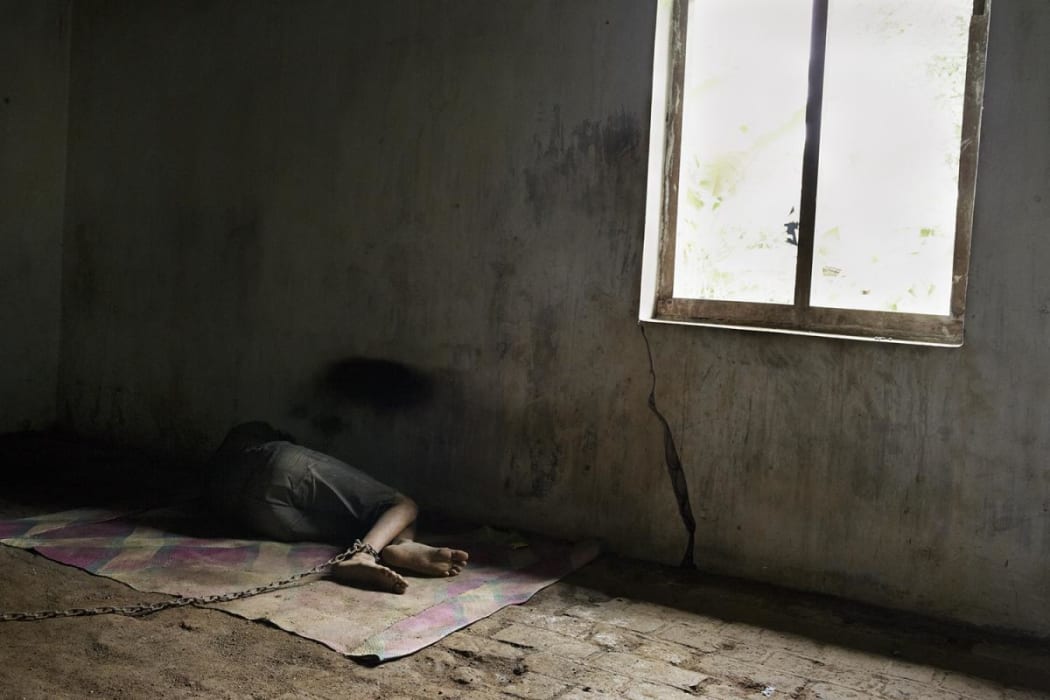 A man in shackles in Indonesia