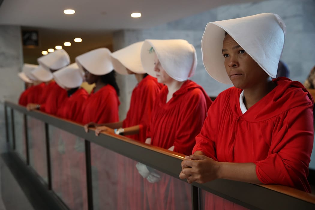 Protesters dressed in The Handmaid's Tale costume, protest outside the hearing room where Supreme Court nominee Judge Brett Kavanaugh will testify before the Senate Judiciary Committee during his Supreme Court confirmation hearing.