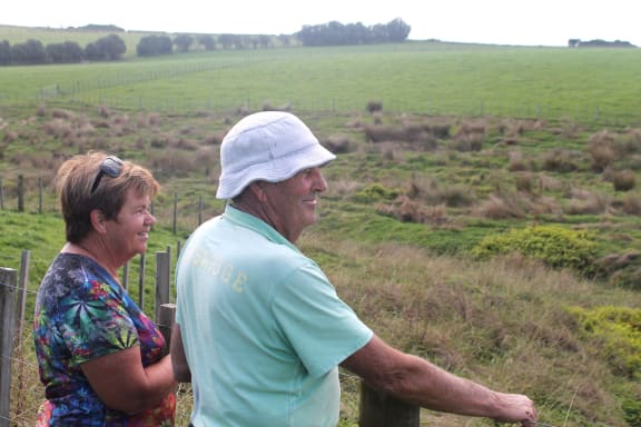 BEFORE  John and Geraldine Taylor survey the 1 75 hectares area along the river the next piece to be replanted