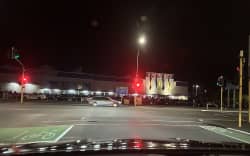 A large crowd gathers in the Spotlight carpark.