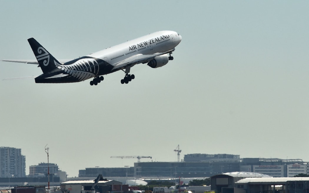 An Air New Zealand plane takes off from the airport in Sydney on August 23, 2017. - Air New Zealand posted a 17.5 percent fall in annual net profit on August 23 as increased competition hit the carrier's bottom line. (Photo by Peter PARKS / AFP)