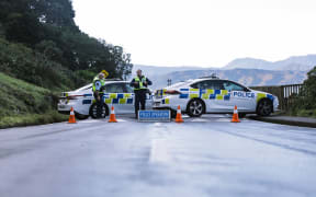 Police have set up a cordon at Scorching Bay, just on the outskirts of the occupation at Mahanga Bay