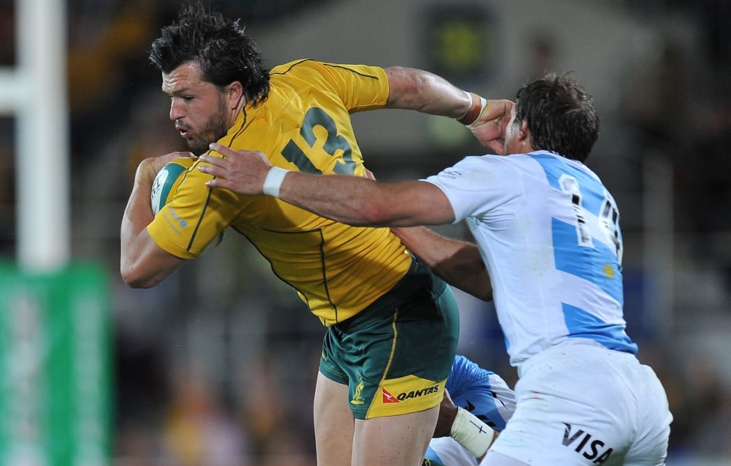 Adam Ashley Cooper of Australia is tackled by Pumas.