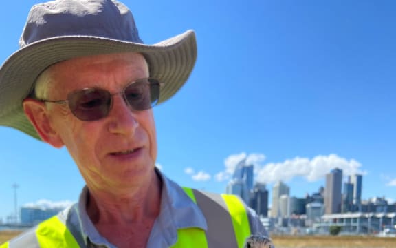 A man holds a small bird.