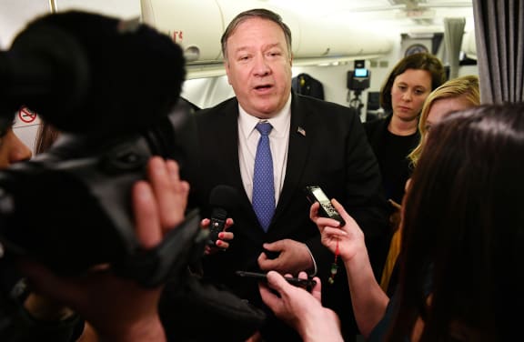 US Secretary of State Mike Pompeo speaks to reporters in flight after a previously unannounced trip to Baghdad on May 8, 2019
