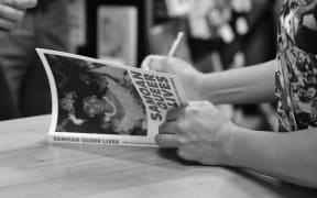 Yuki Kihara autographing Samoan Queer Lives