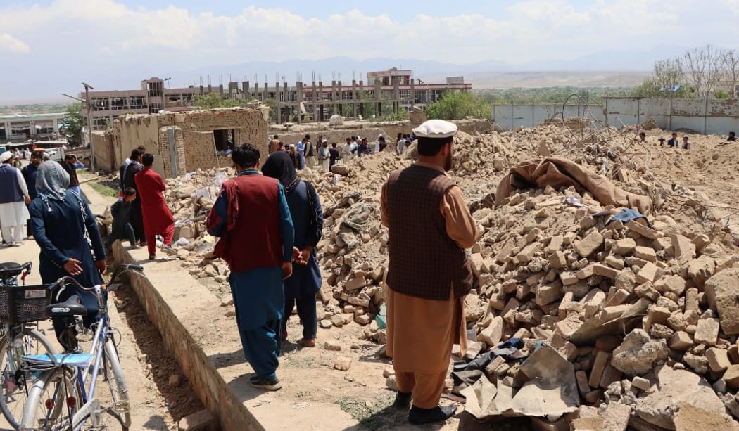 LOGAR, AFGHANISTAN MAY 01: Afghan residents inspect the seen after a truck bomb attack in the capital Logar Province, Afghanistan on May 1, 2021.